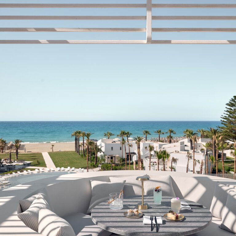 Sky Bar dining area with panoramic resort views at Grecotel Creta Palace
