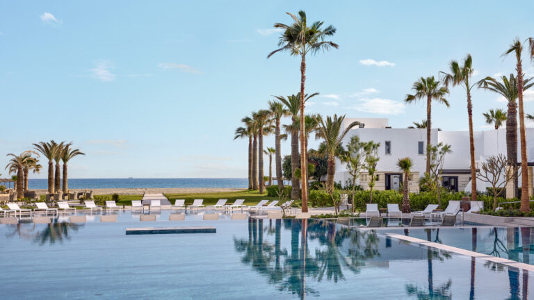 Main pool and infinity pool lifestyle at Grecotel Creta Palace