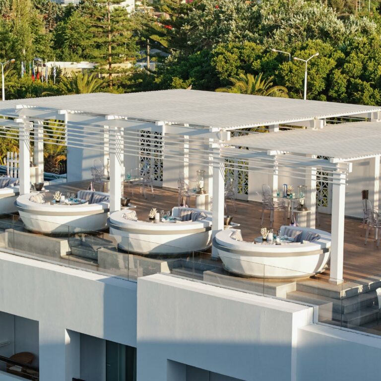 Sky Bar dining area with panoramic resort views at Grecotel Creta Palace