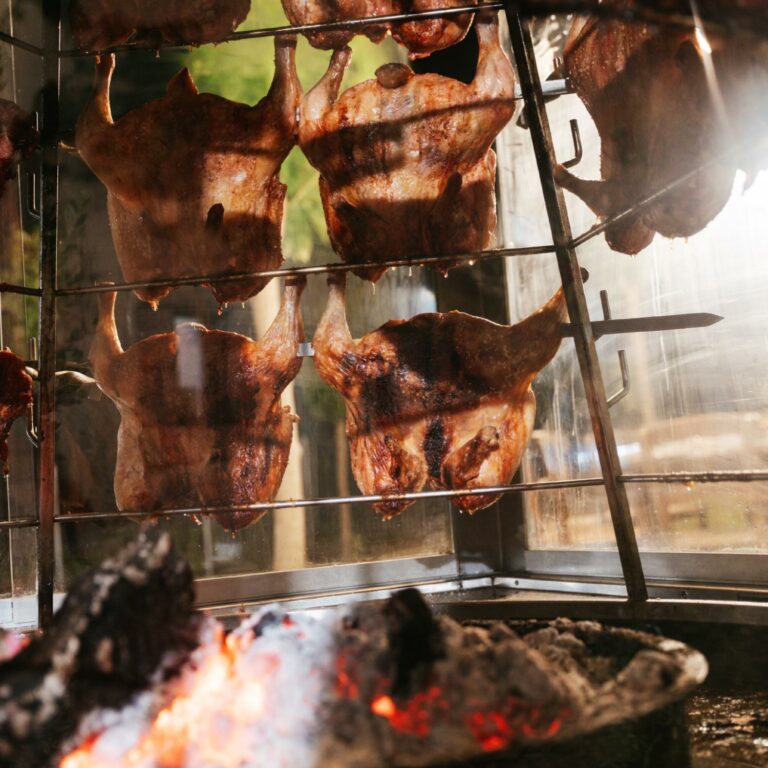 Traditional meat roasting over an open fire at Agreco Farm.