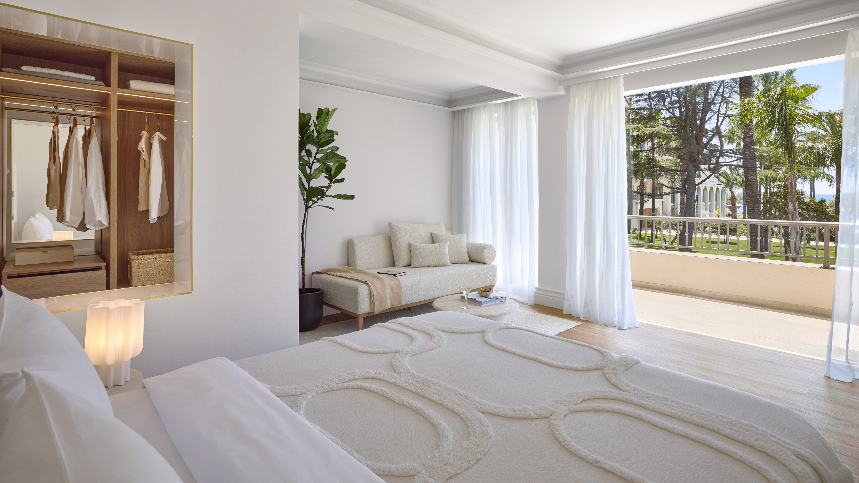 Deluxe Room Panoramic bedroom with sitting area and balcony at Filoxenia Kalamata