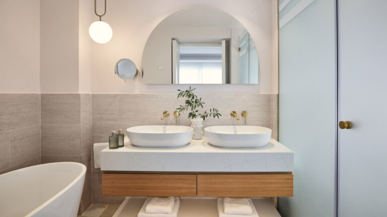 Deluxe Suite bathroom with freestanding bathtub and double vanity