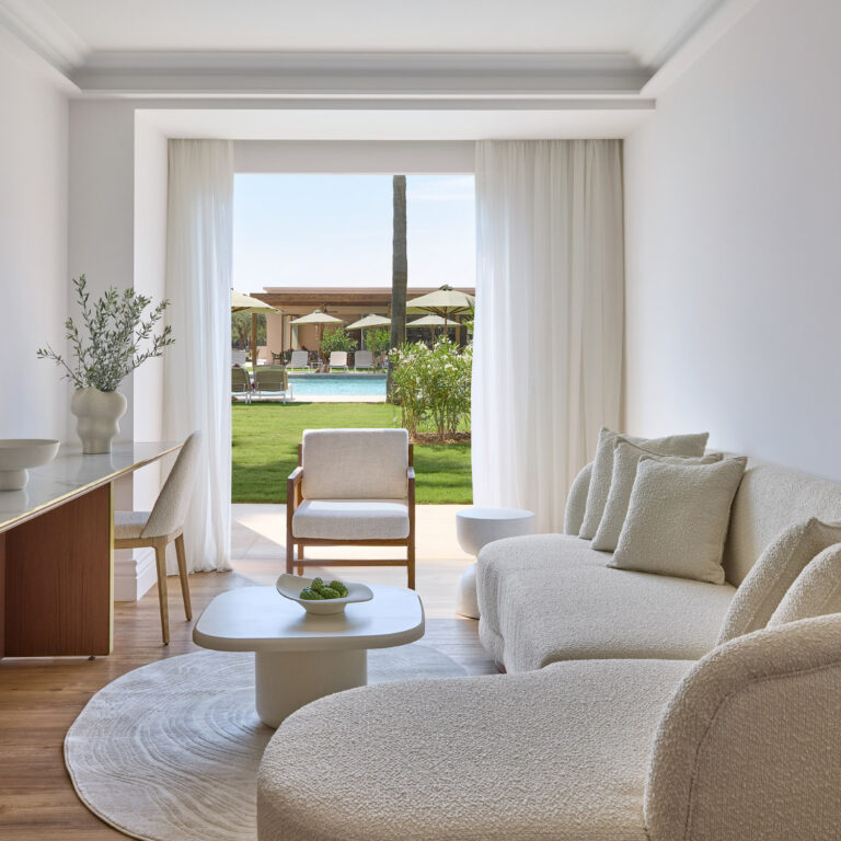 Deluxe Suite Sea Front Palm Gardens living area overlooking the pool and gardens