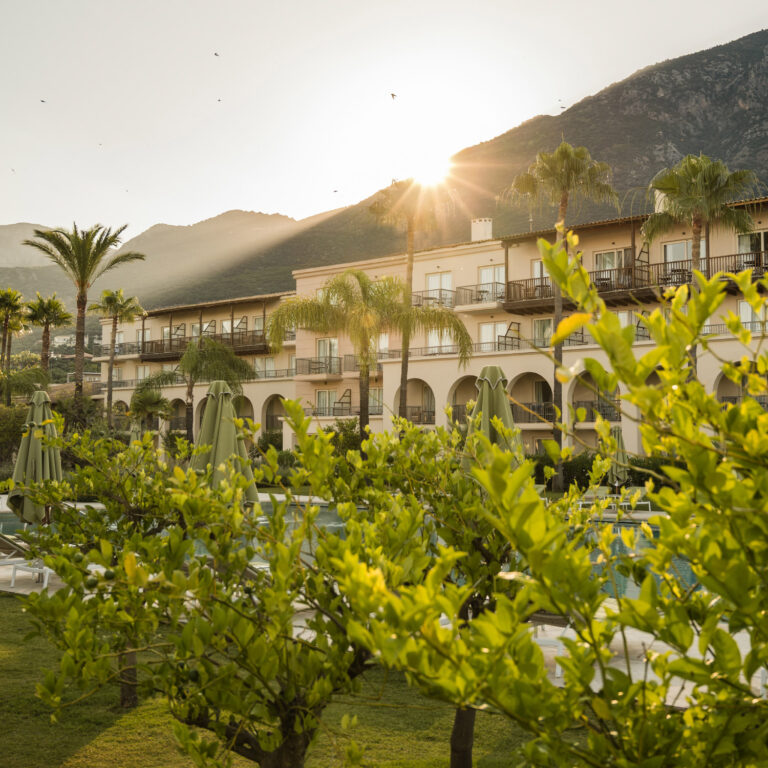 Filoxenia Kalamata resort exterior and gardens at sunset