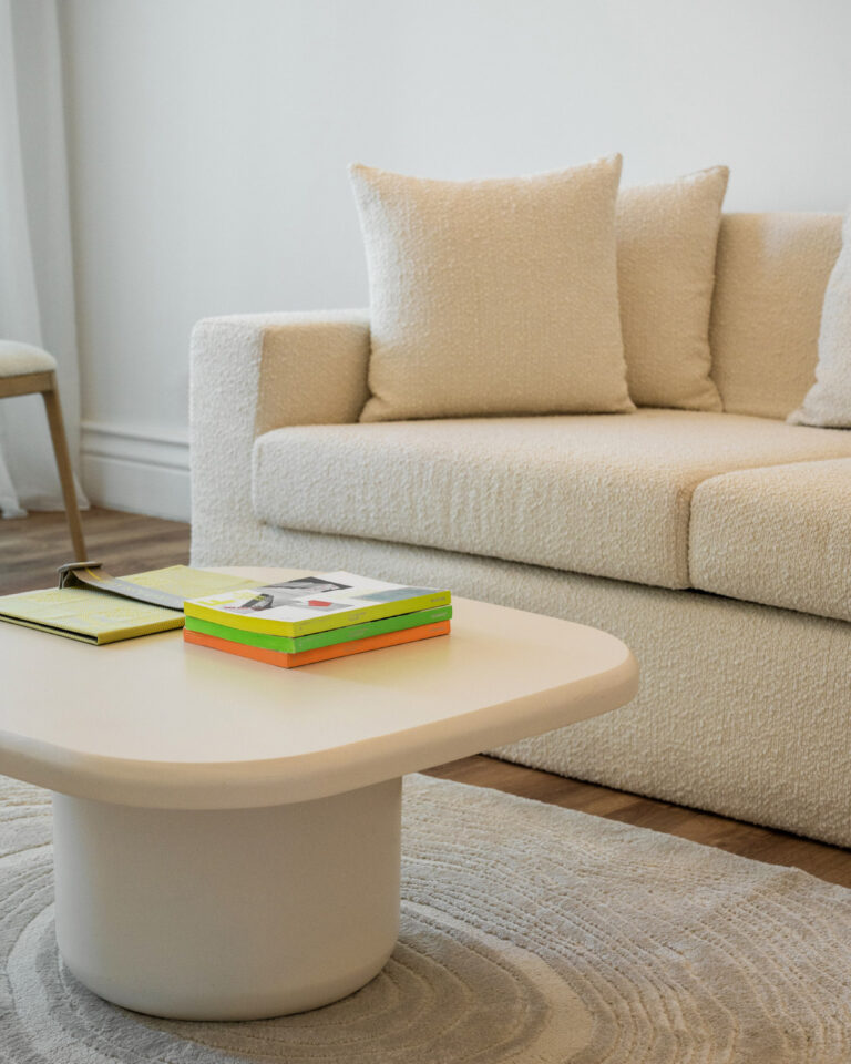 Deluxe Suite living area with sofa and contemporary furnishings