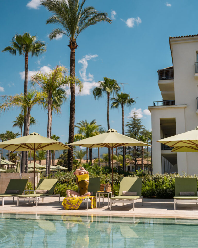 Guest relaxing by the swimming pool at Filoxenia Kalamata