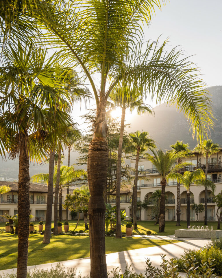 Palm gardens and resort buildings at Filoxenia Kalamata at sunset