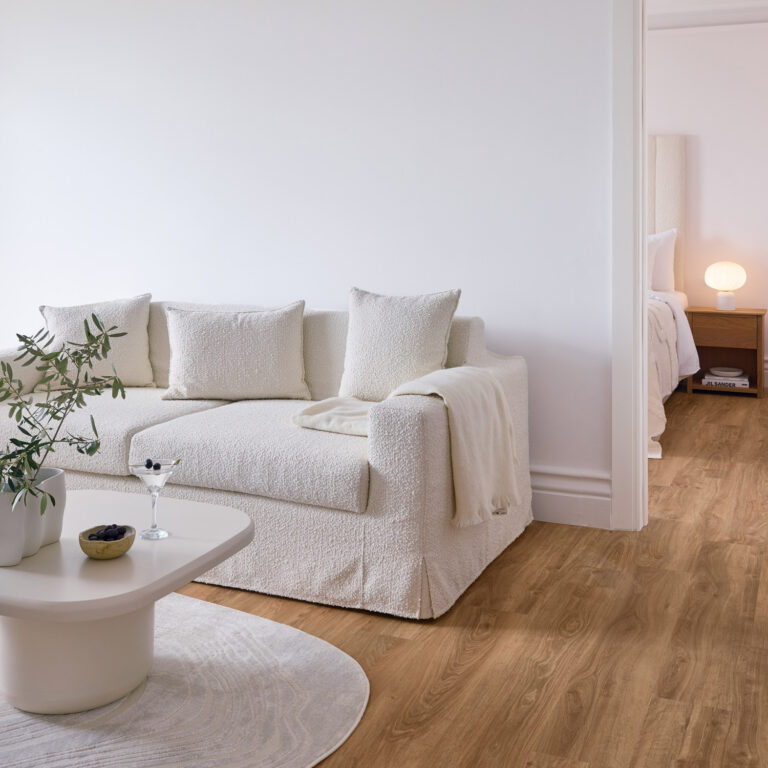Two Bedroom Luxury Suite living area with sofa and adjoining bedroom