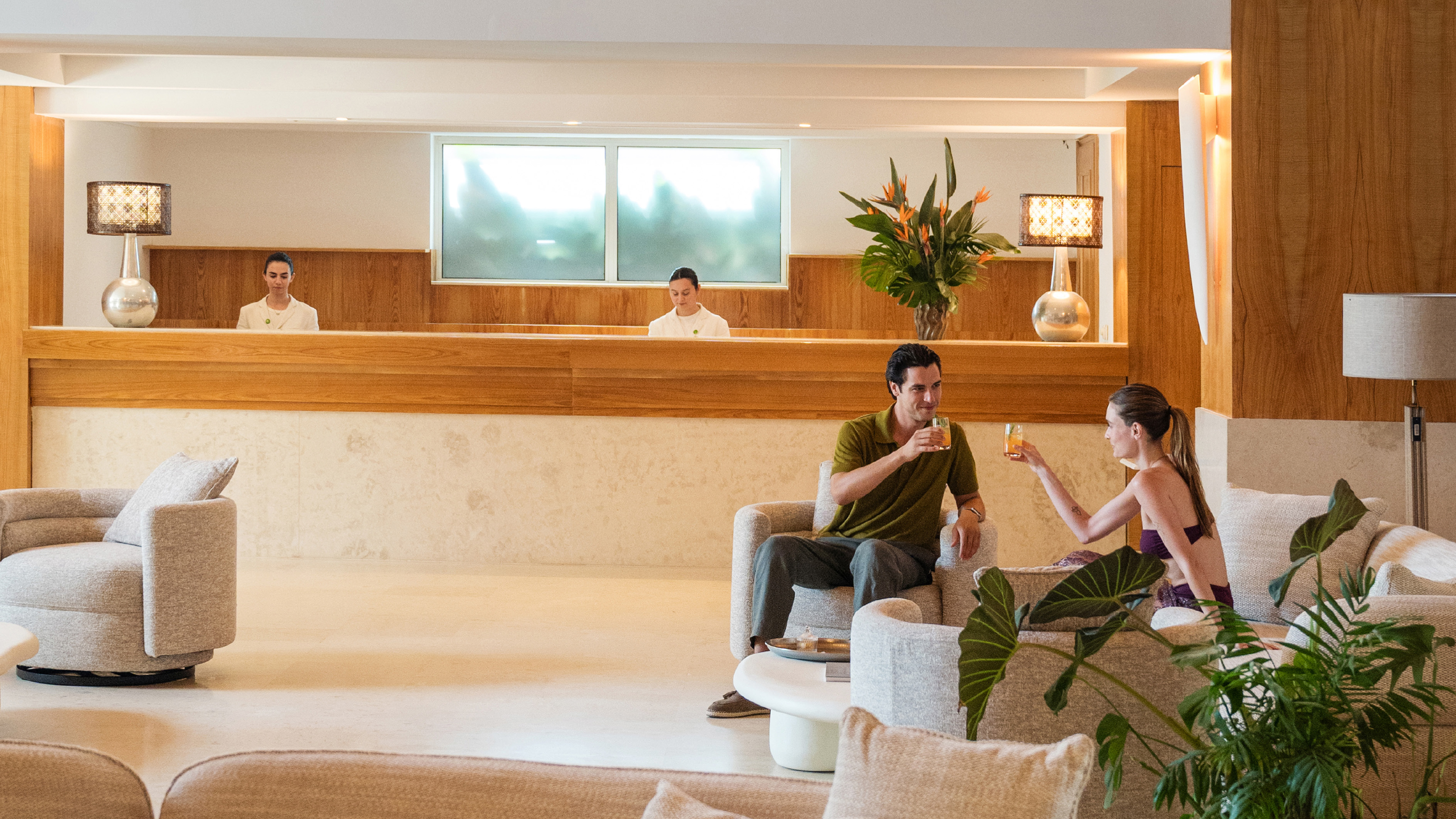 Couple enjoying drinks in the hotel lobby lounge