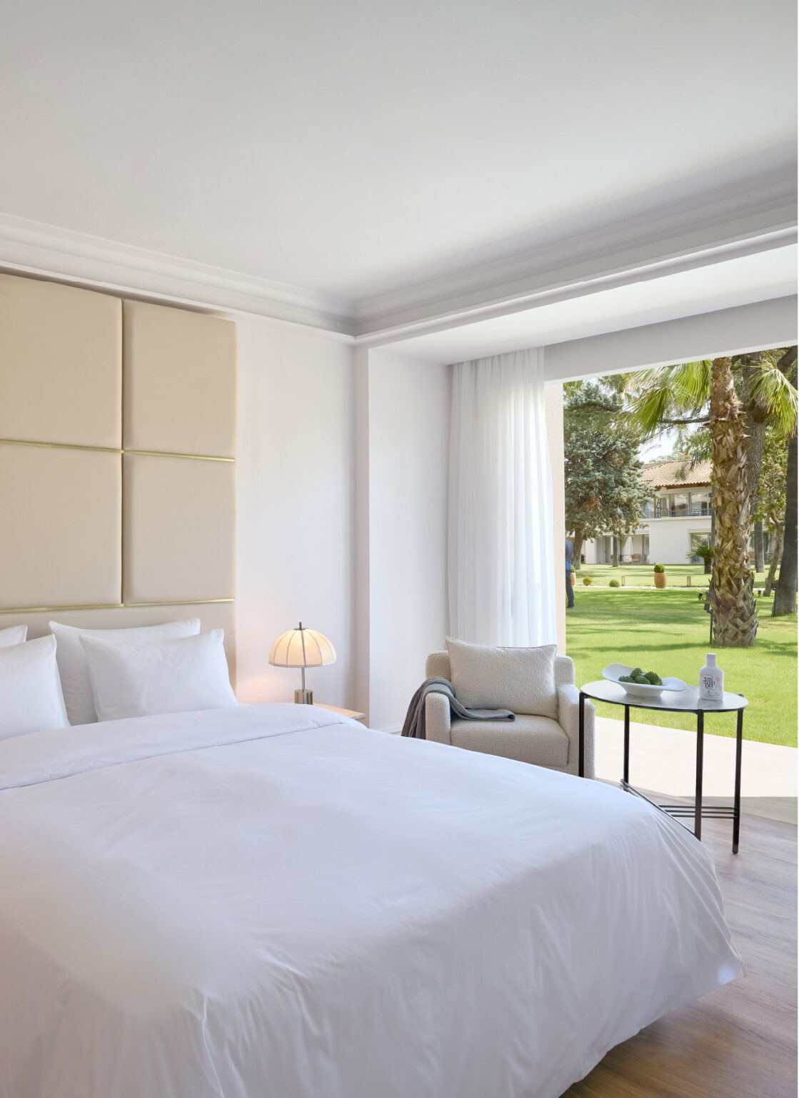 Deluxe Family Suite bedroom opening onto a private garden patio
