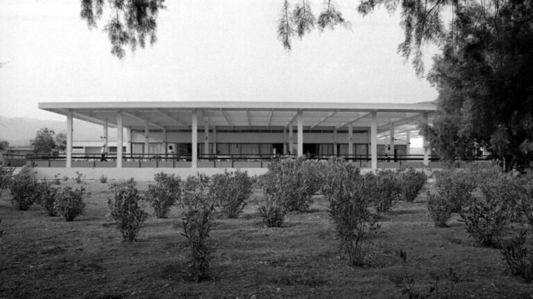 Historic black-and-white photo of the original Filoxenia Kalamata building and gardens
