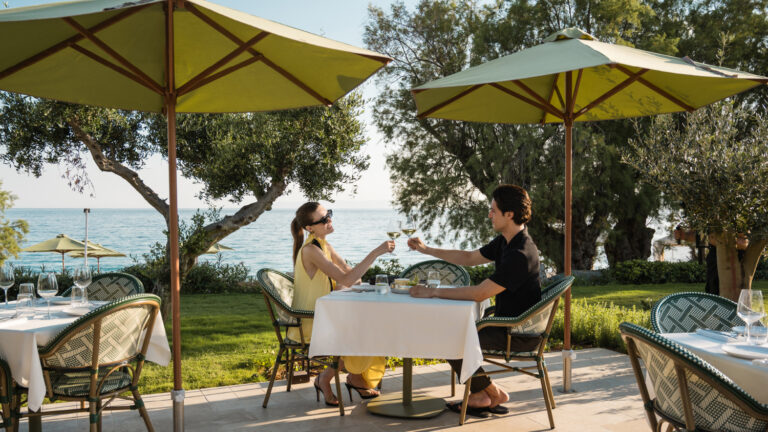 Couple enjoying wine at the seaside restaurant of Filoxenia Kalamata