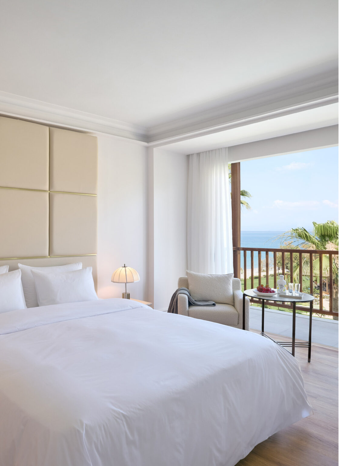 Deluxe Suite bedroom with balcony and sea view at Filoxenia Kalamata