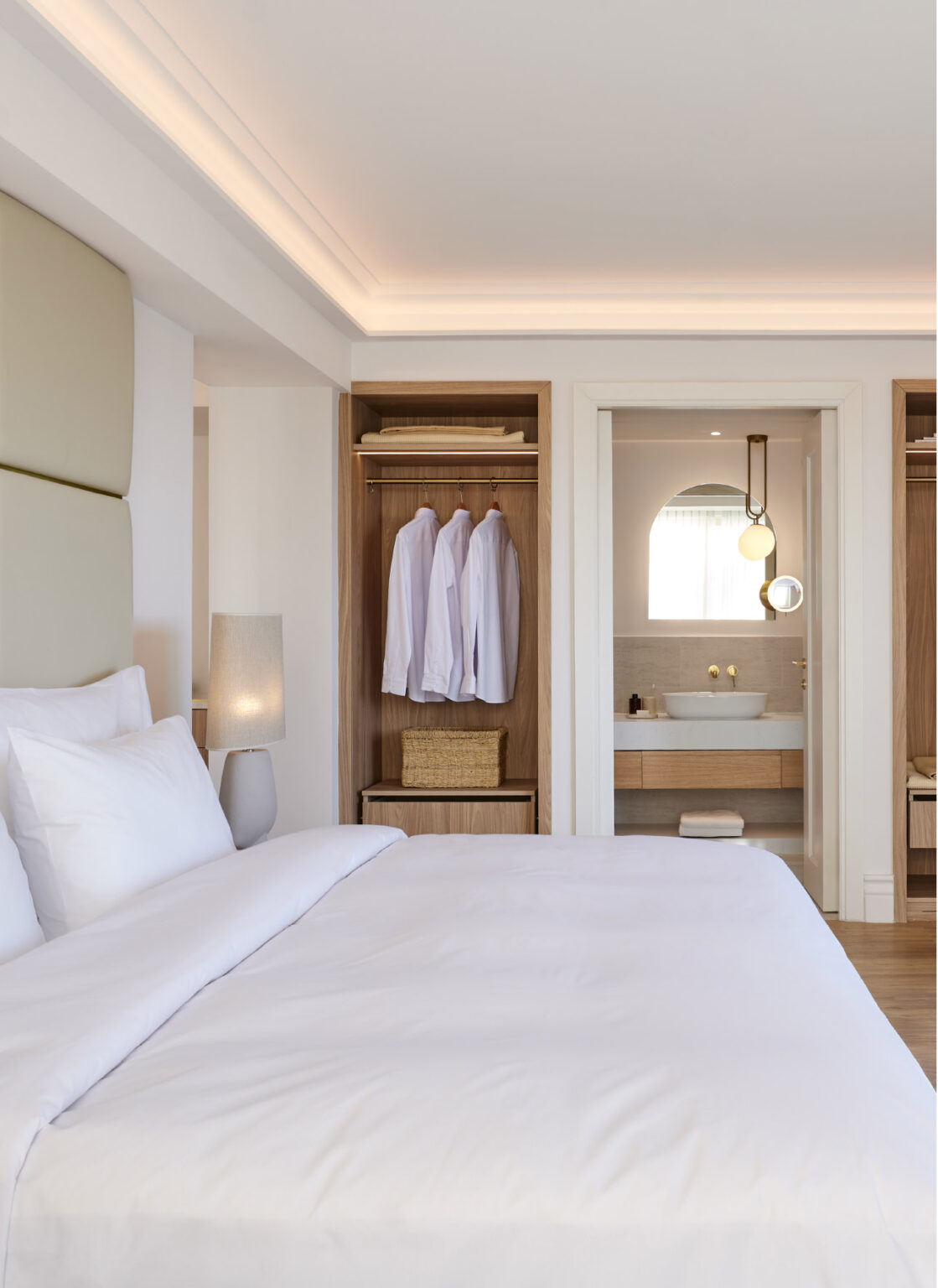 Deluxe Seafront Suite bedroom with elegant interiors and ensuite bathroom
