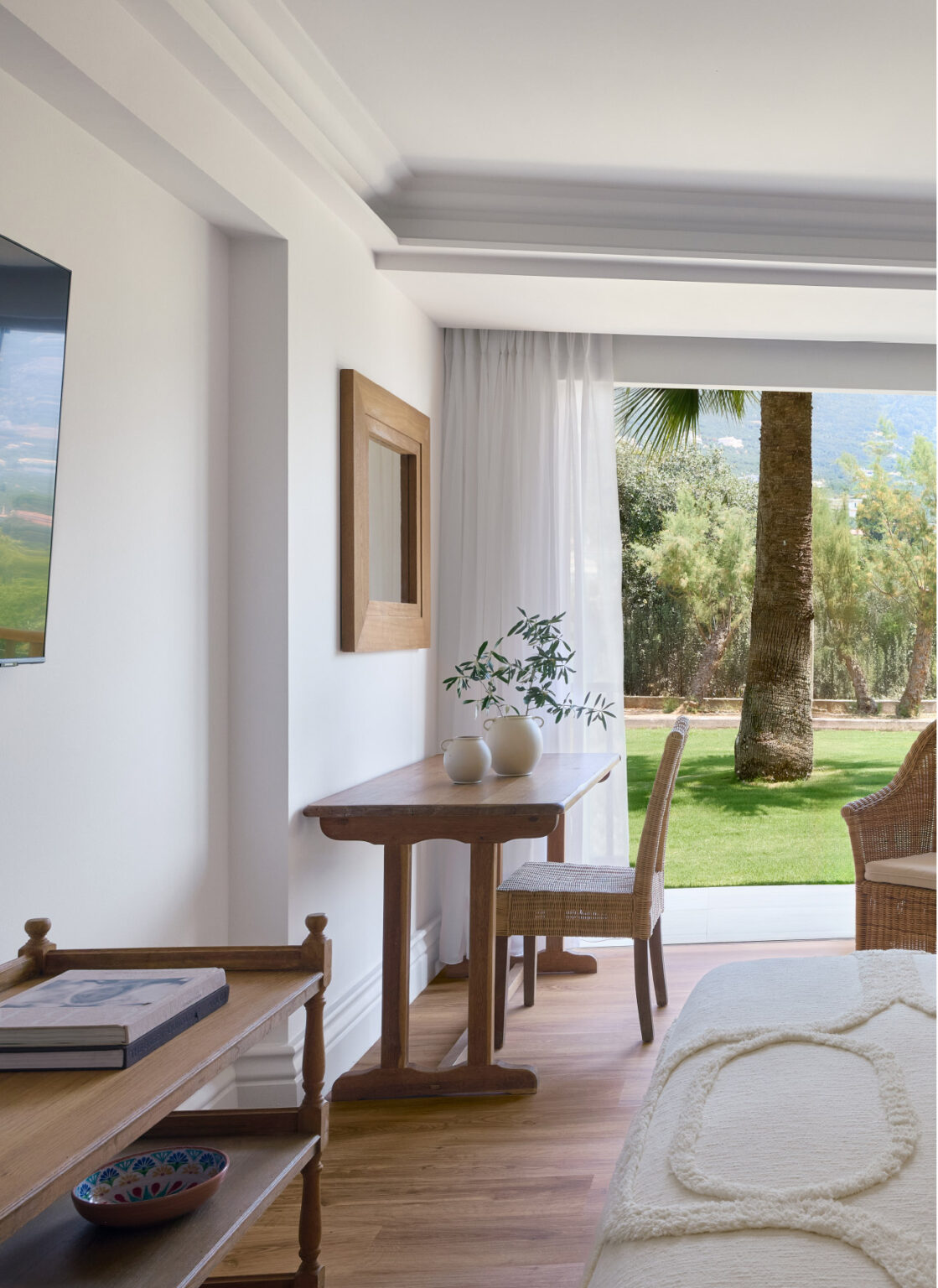 Garden Room interior with furnished veranda and garden view