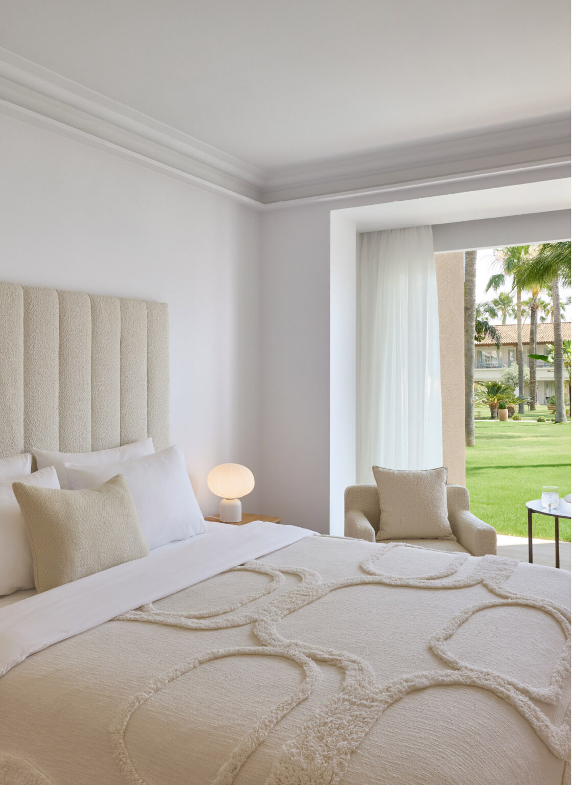 Superior Panoramic Room bedroom overlooking palm trees and gardens