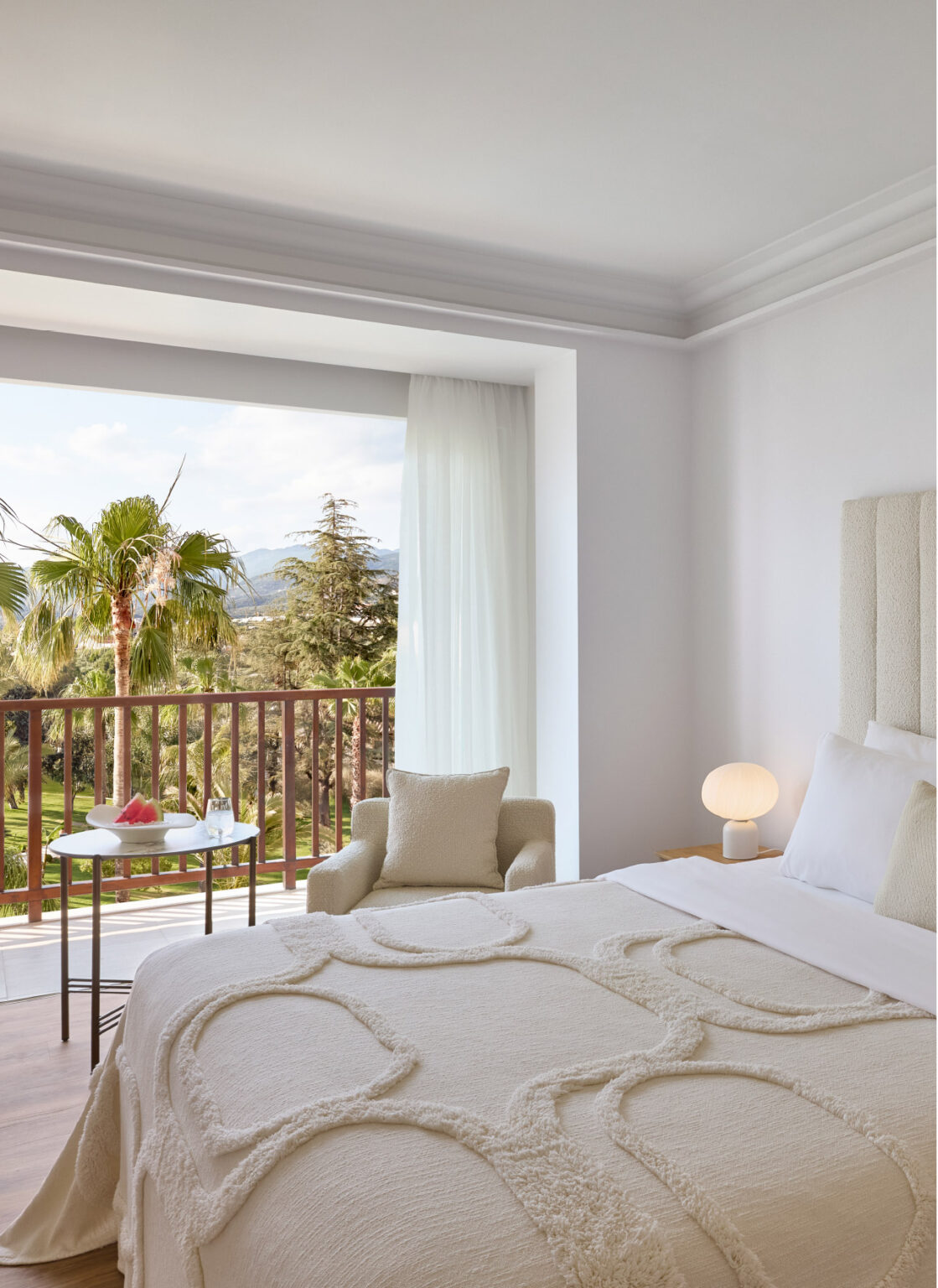 Superior Panoramic Room bedroom with balcony and side sea view