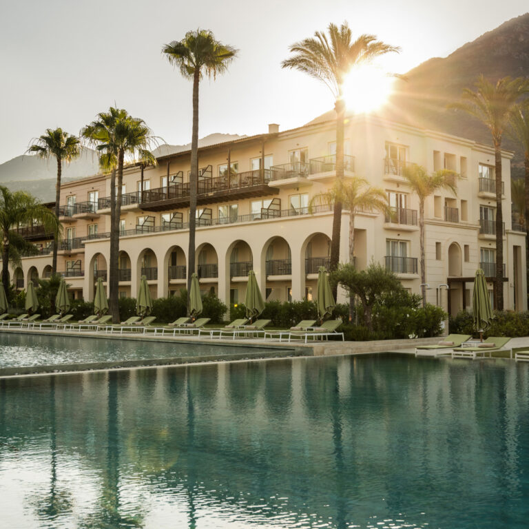 Outdoor swimming pools and hotel exterior at Grecotel Filoxenia Kalamata