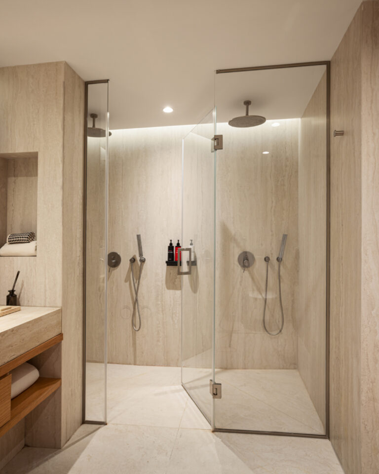 Walk-in shower in luxury family suite bathroom