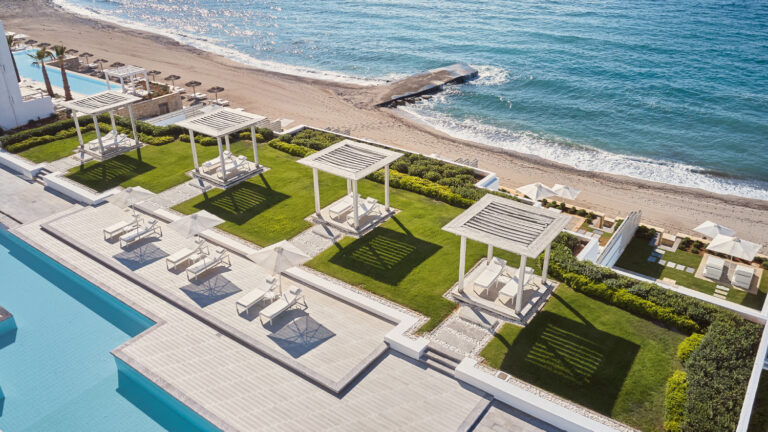 Grecotel LUXME White Crete pool area with cabanas, sunbeds, gardens and sea view