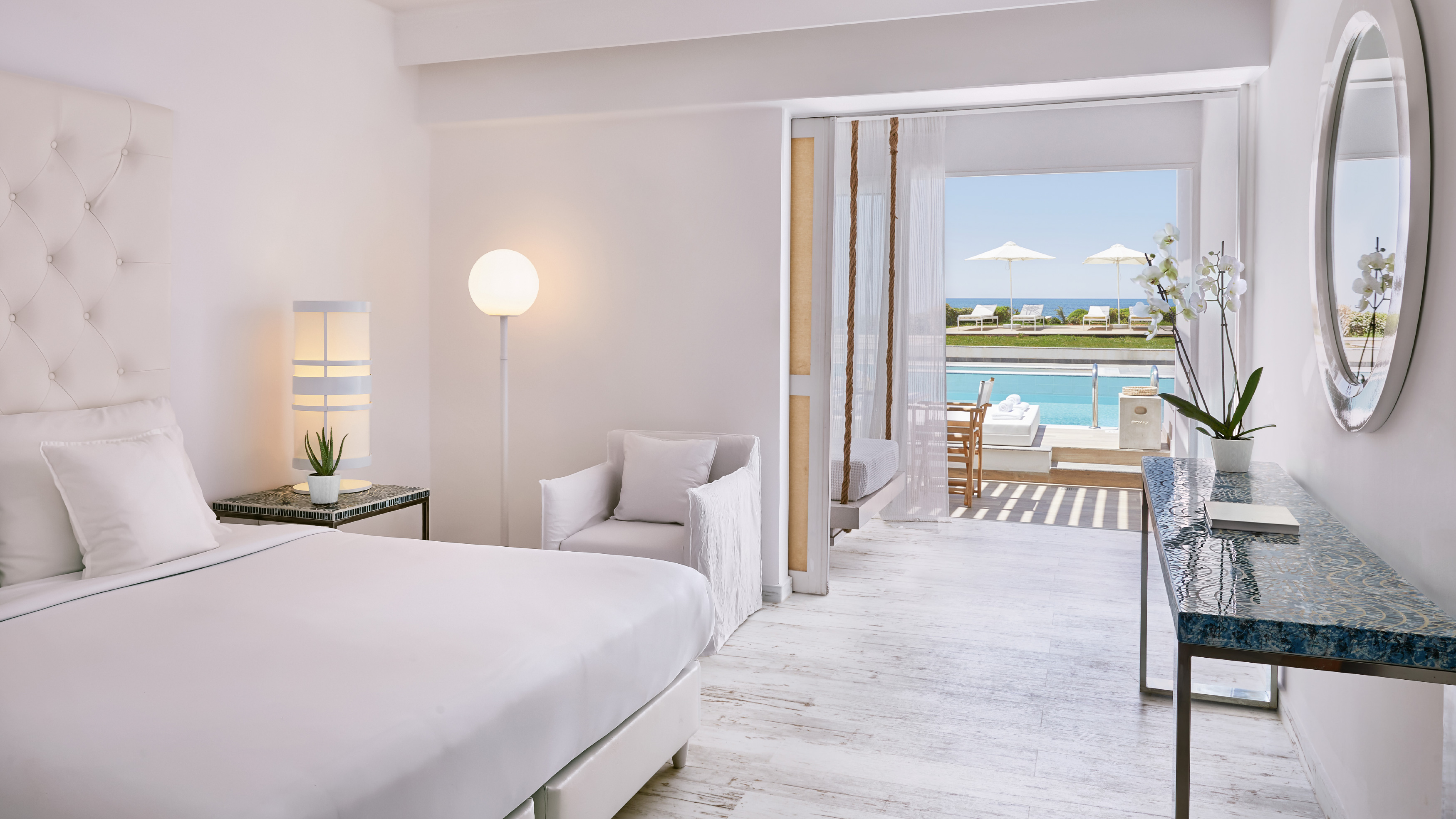 Grecotel LUXME White Crete swim-up guestroom with direct pool access and sea view