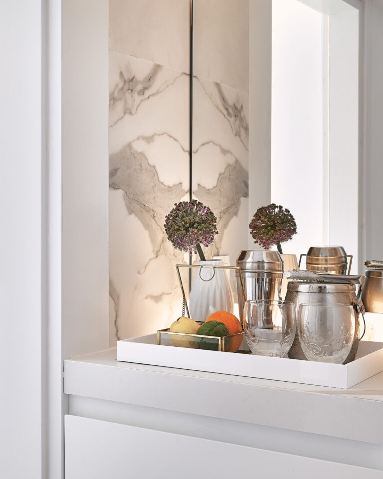 Grecotel LUXME White Crete Family Apartment refreshments with fruit, drinks and flowers.