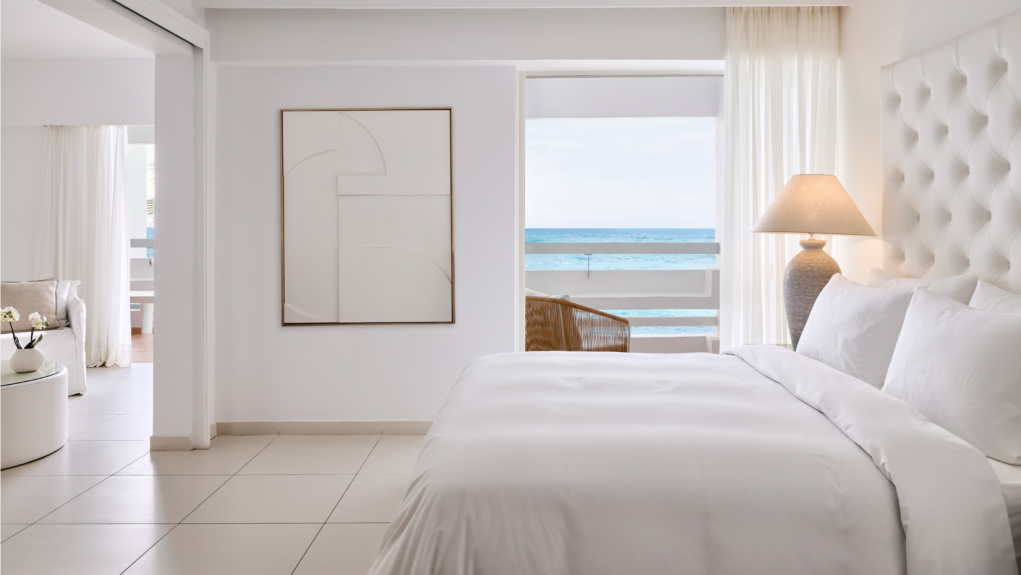 Grecotel LUXME White Crete White Family Suite bedroom with king bed and sea view.