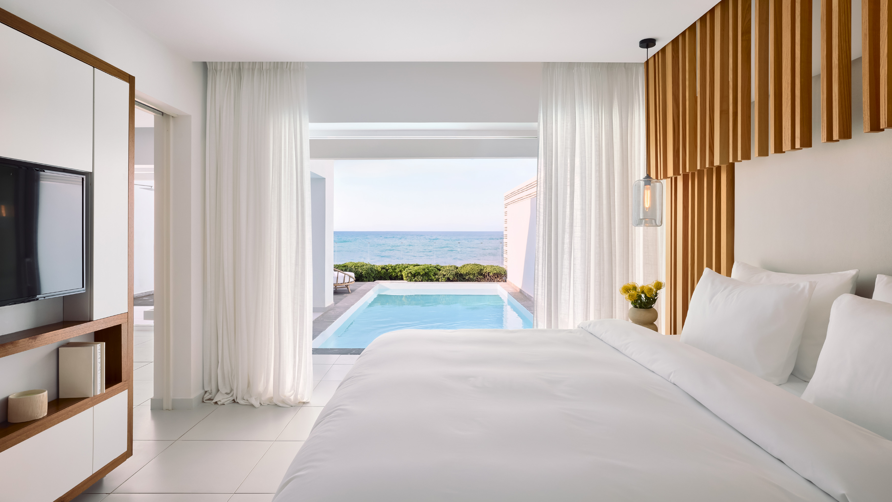 Grecotel LUXME White Crete Villa Luxe Yali bedroom with private pool and sea view.