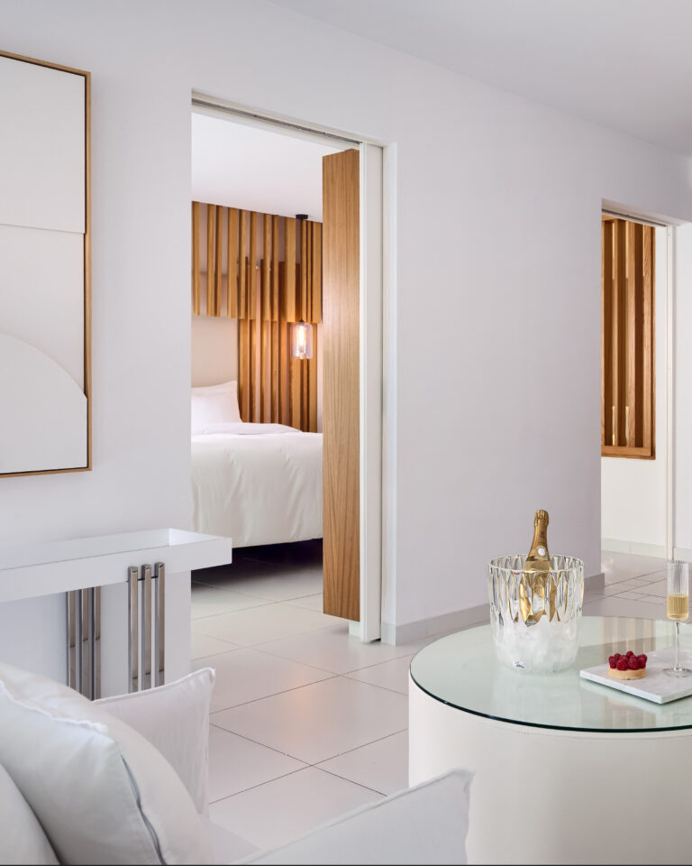 Grecotel LUXME White Crete Villa Luxe Yali living area with champagne and seating.
