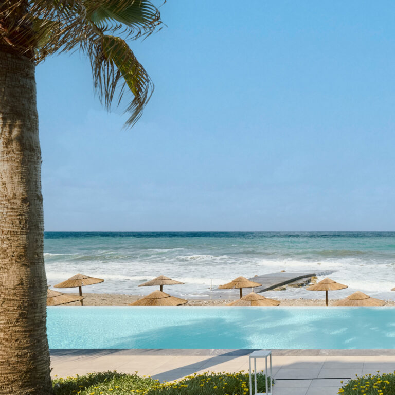 Grecotel LUXME White Crete pool overlooking the beach and sea.