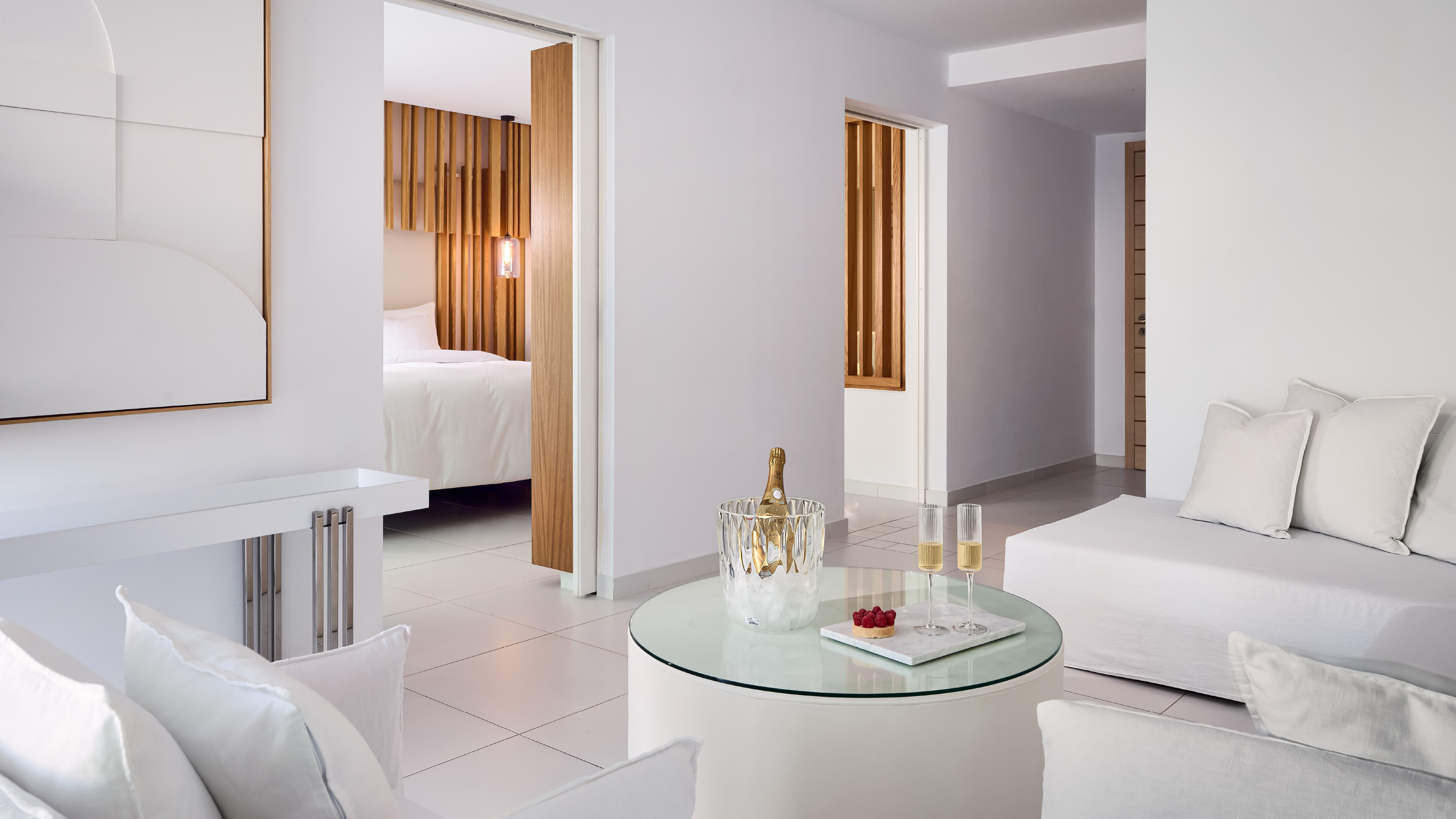 Grecotel LUXME White Crete Villa Luxe Yali living area with champagne and sofa.