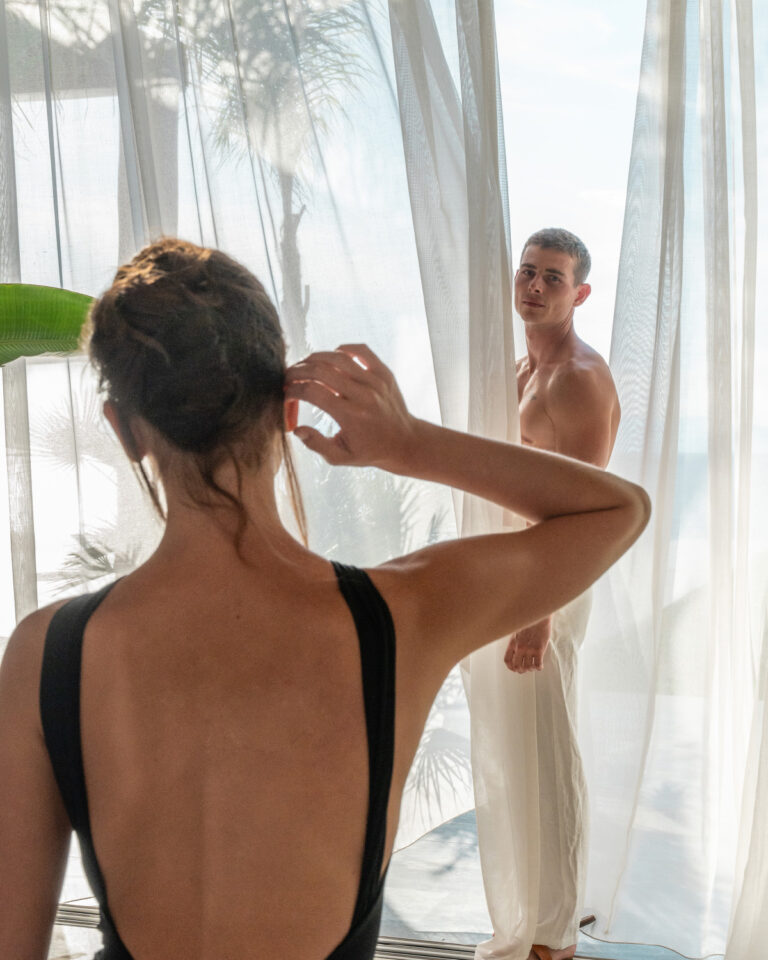 Couple relaxing in a sea view suite at Grecotel LUXME White Palace in Crete