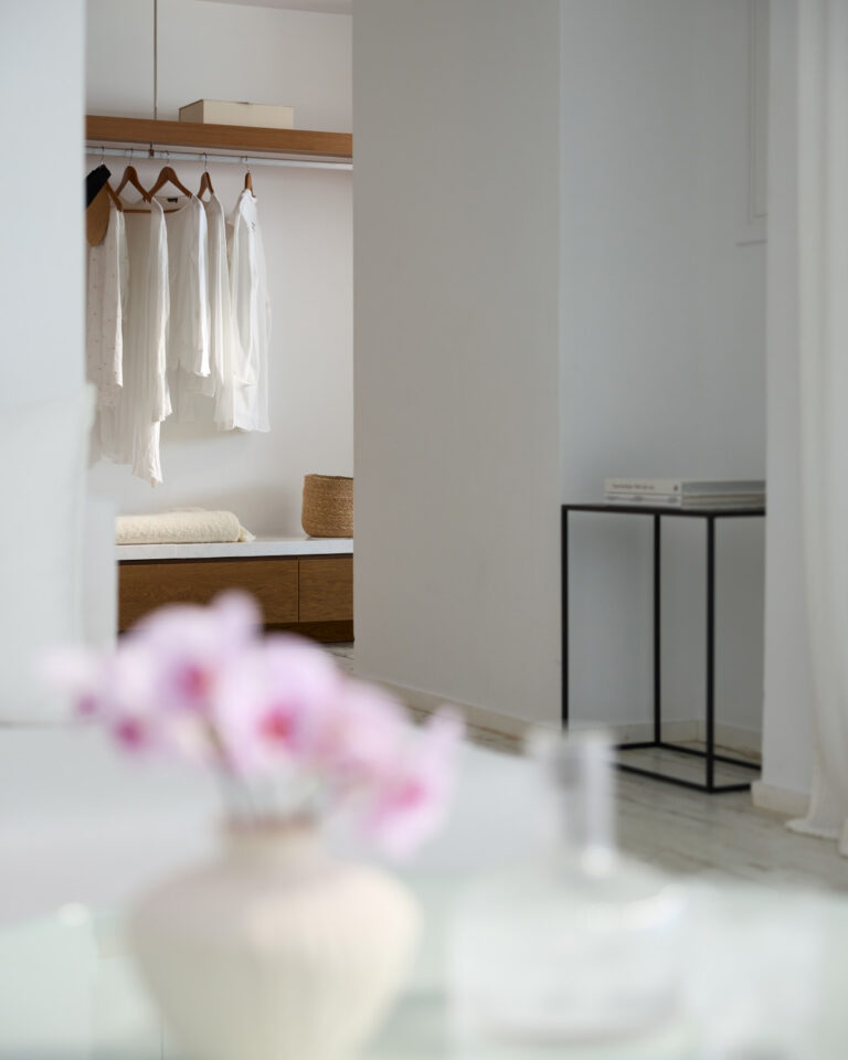 Grecotel LUXME White Crete Grand Family Suite wardrobe with hanging clothes and storage.