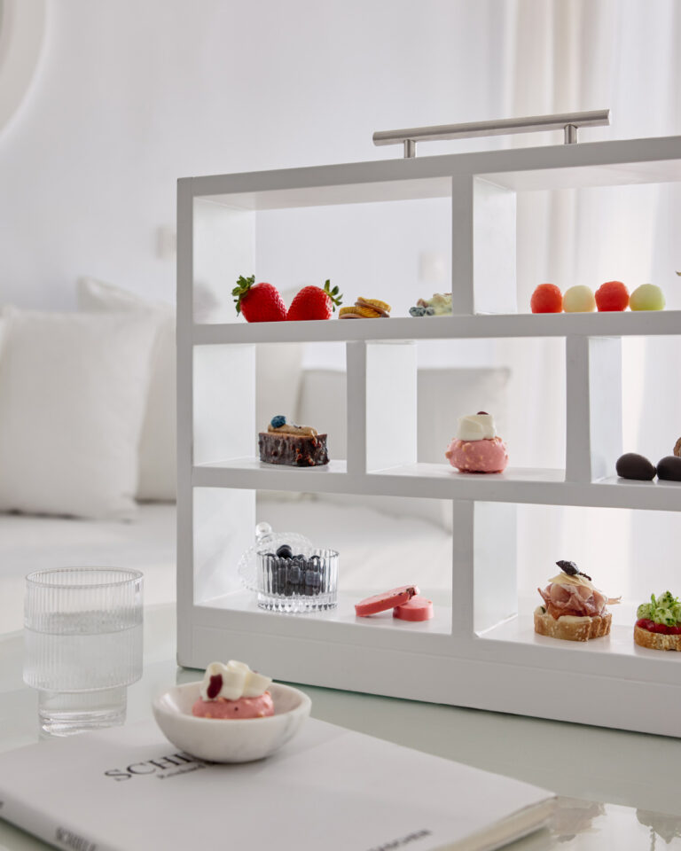 Fresh fruit and desserts displayed in a Grecotel LUXME White Crete Petit Yali Seafront Suite.