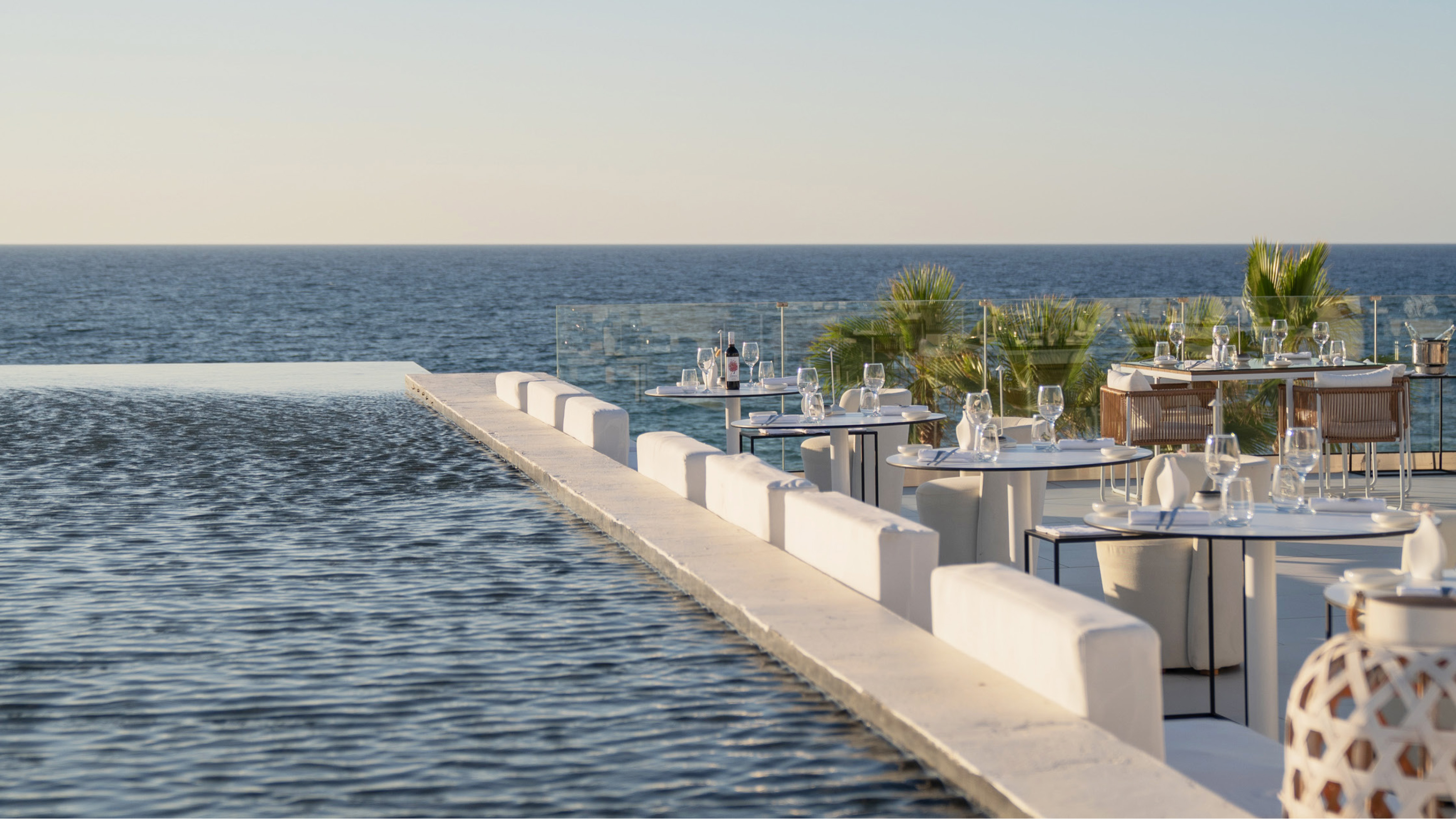 Grecotel LUXME White Crete The White Restaurant dining terrace overlooking the sea.