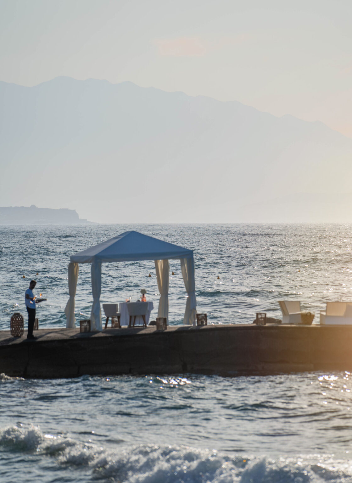 Wedding ceremony setup on the sea pier at Grecotel LUXME White Crete.