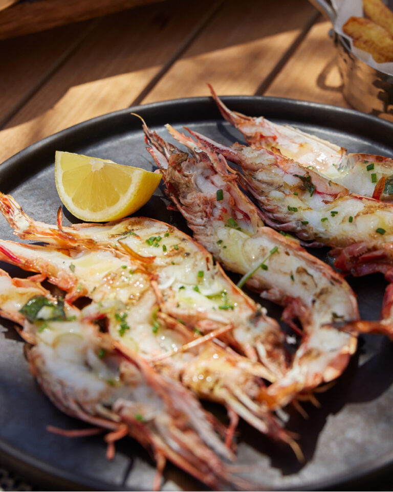 Grilled prawns with lemon served at Lobsteria at Grecotel LUXME White Crete.