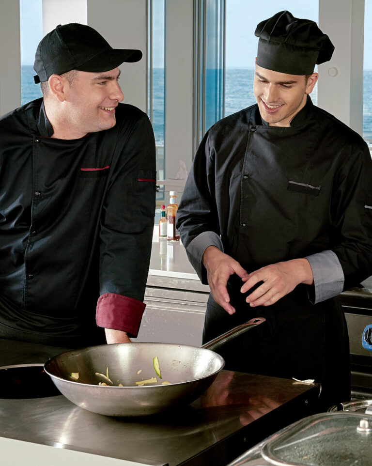 Chefs preparing food as part of the dining offer at Grecotel LUXME White Crete.