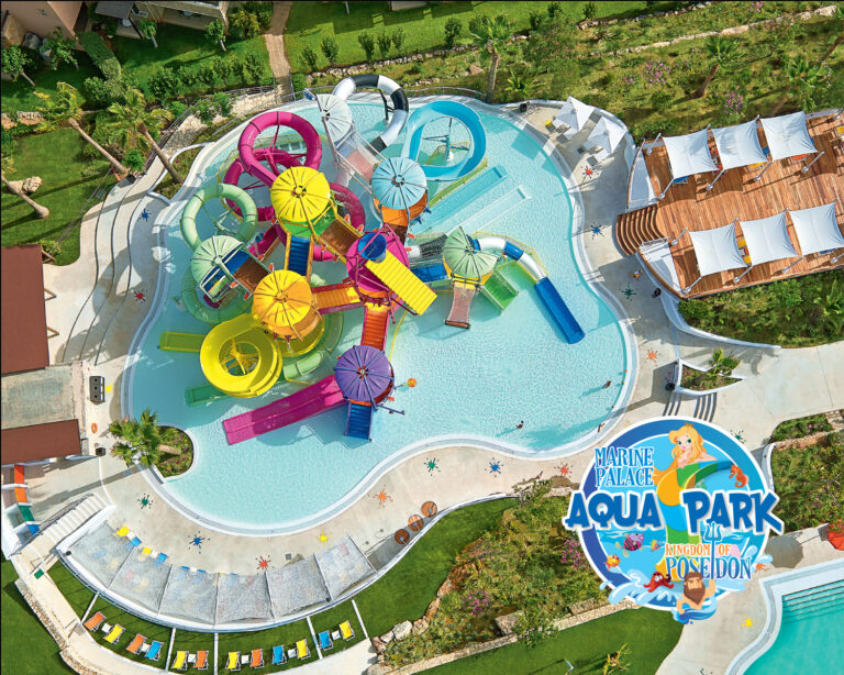 Aerial view of Grecotel Marine Palace Aqua Park with colourful water slides and pools.