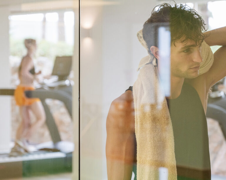 Man relaxing in the sauna at Grecotel LUXME White Crete.