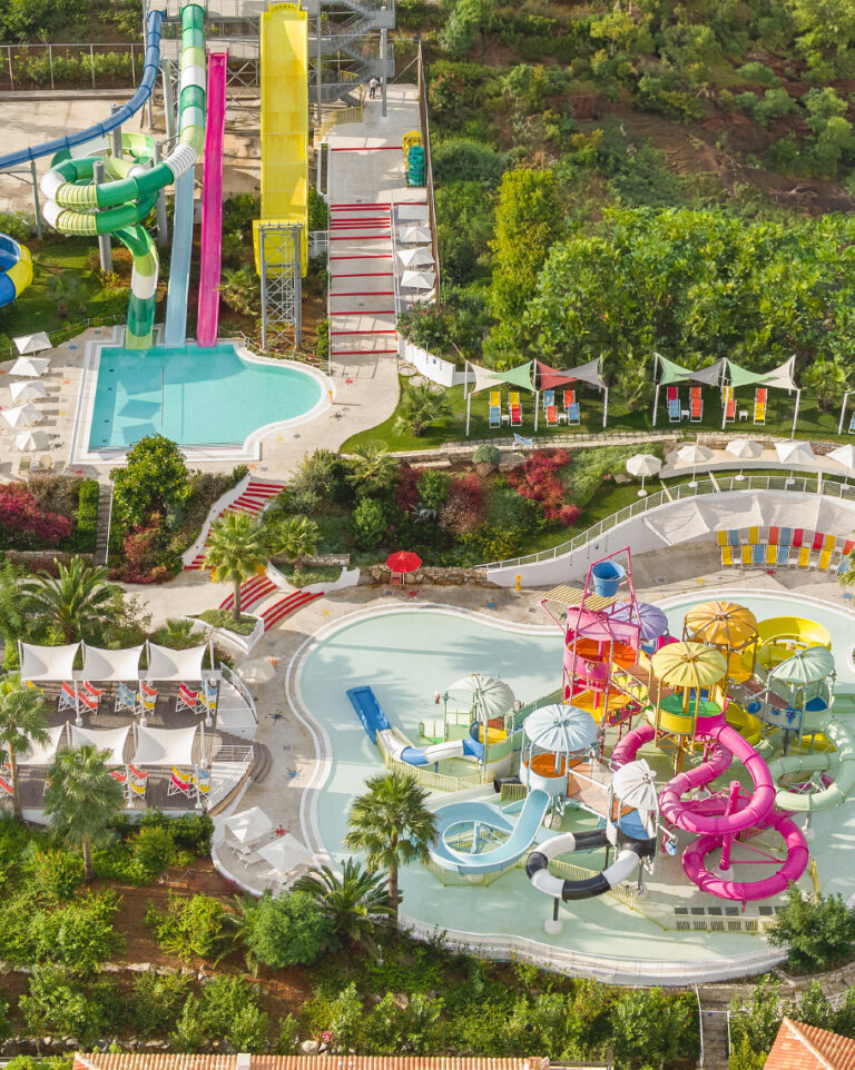 Aerial view of Grecotel Marine Palace Aqua Park with water slides and pools.