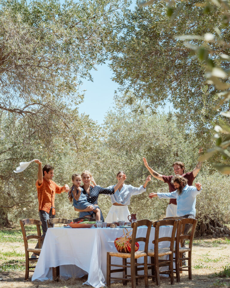 Family dining and enjoying time together at Agreco Farm near Grecotel LUXME White.